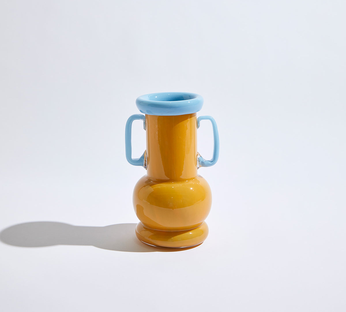Loca Apricot Vase, apricot glass vase with sculptural shape and bold color.
