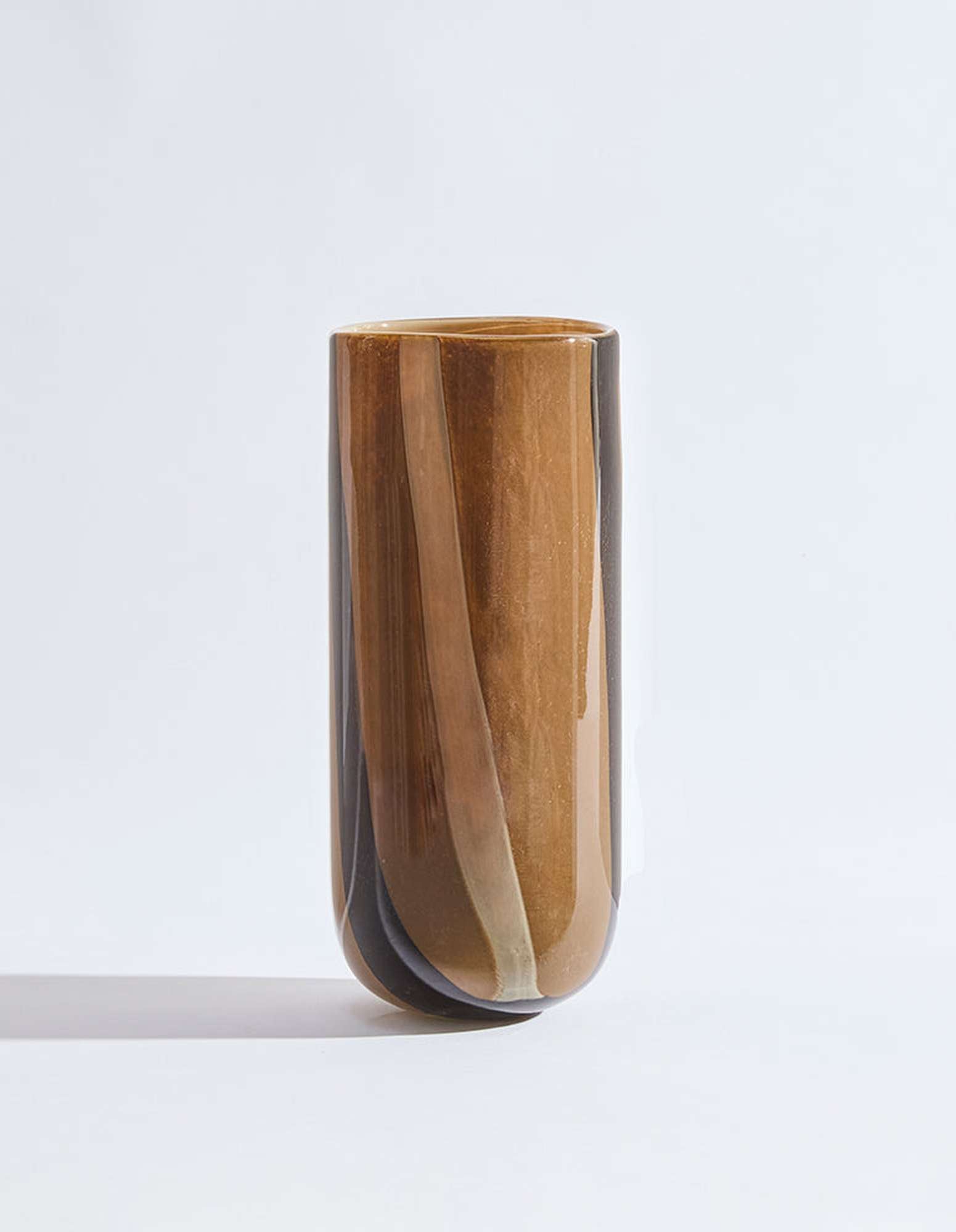 Chocolate glass vase with soft stripe details and warm tones