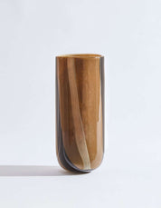 Chocolate glass vase with soft stripe details and warm tones