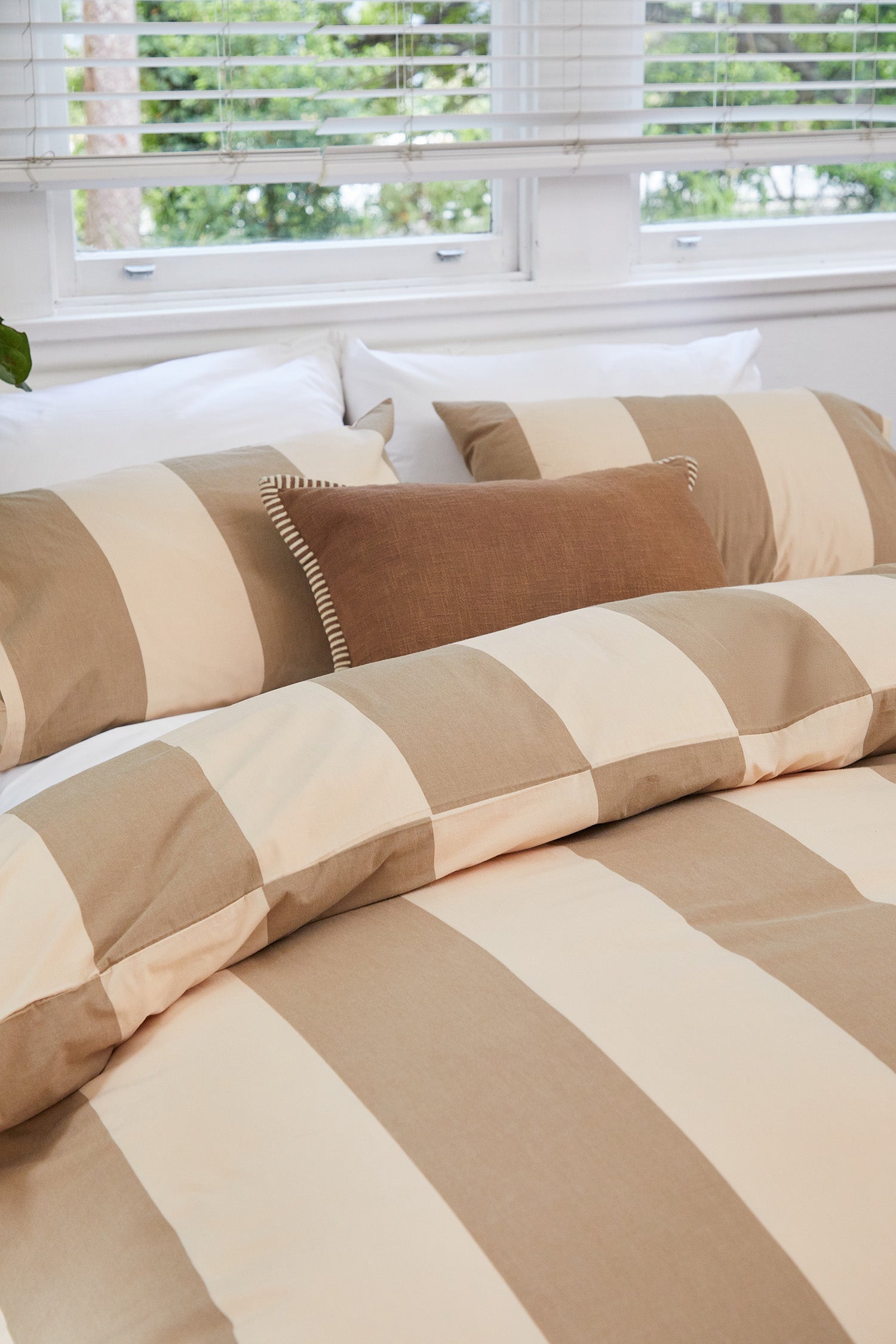 Breeze Blush Quilt Cover Set, flat lay with bold stripes and soft blush tones