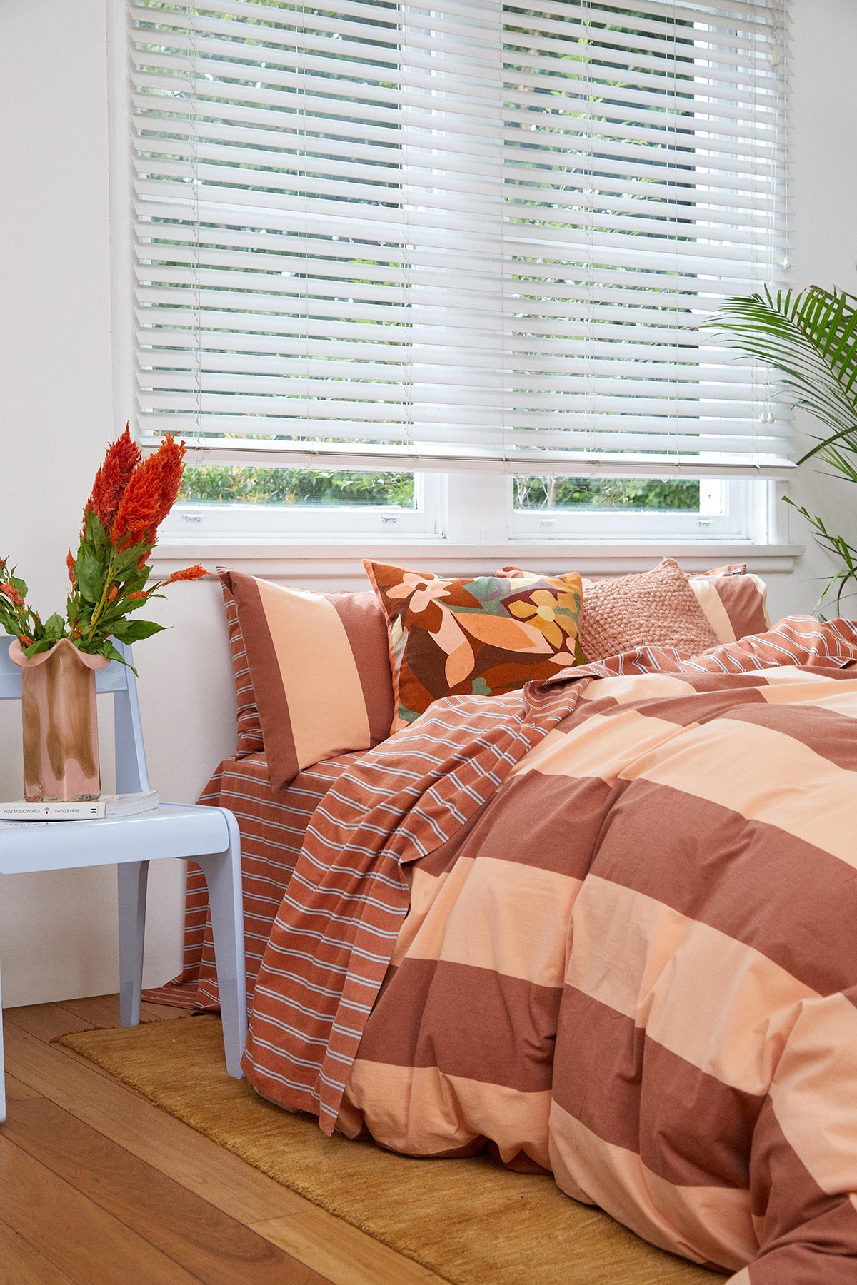 Breeze Rust Quilt Cover Set, rust-colored stripes on a bed