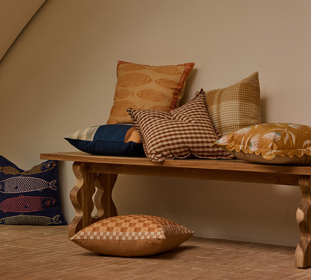 Bellini Toffee Cushion in lifestyle setting, angled view showing geometric pattern