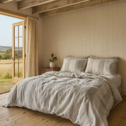 Somerton Quilt Cover in natural tones, striped pattern on a bed